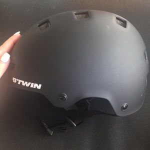 Black helmet for biking, skating, long boarding.